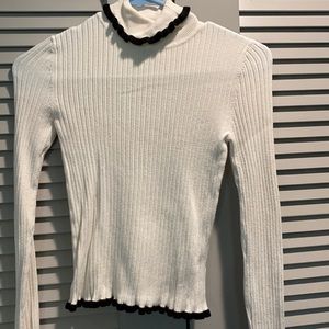 White and black sweater